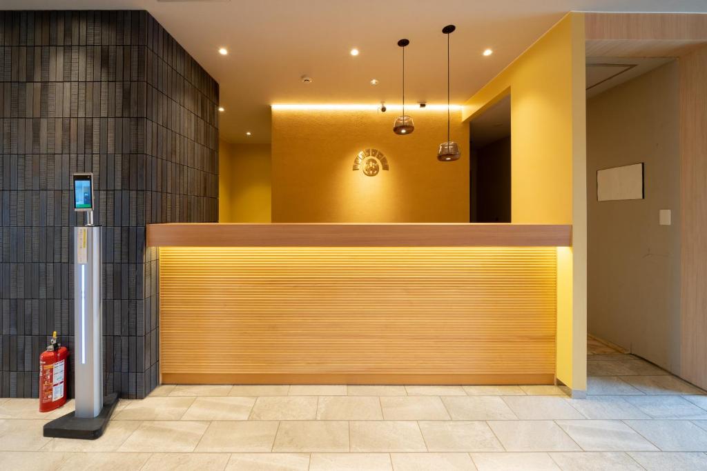 a large wooden garage door in a building at Hotel Sun in Takasaki
