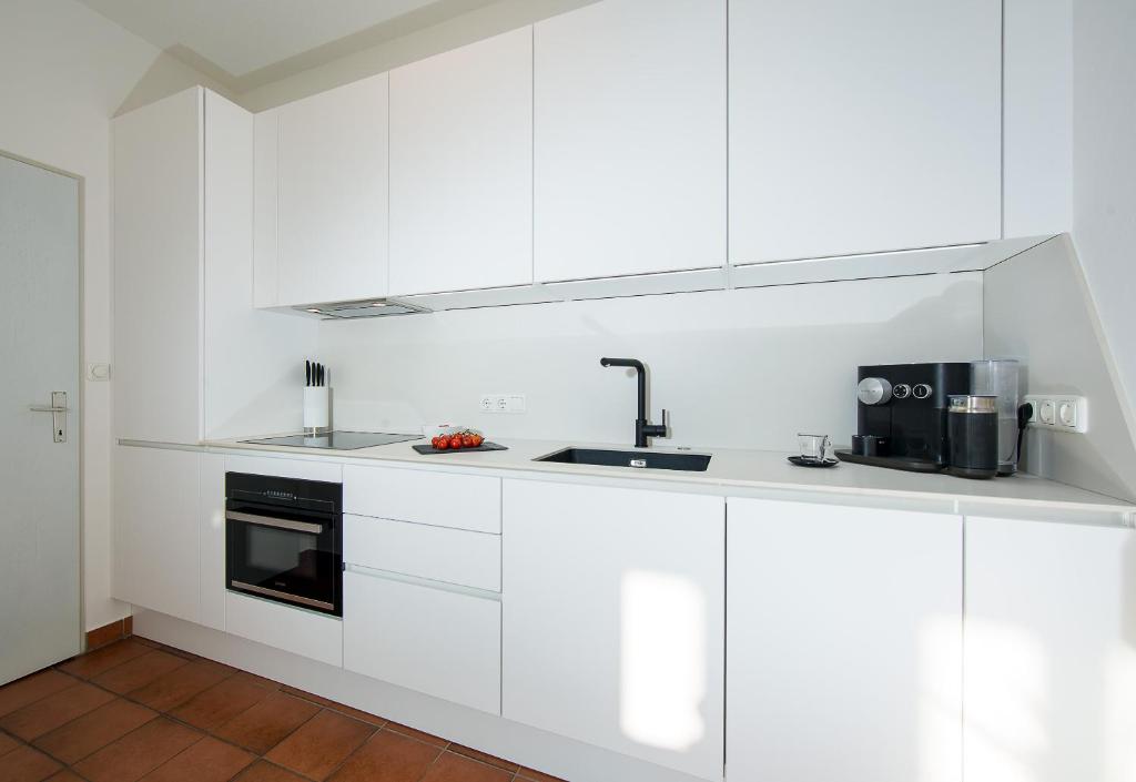 Kuchyň nebo kuchyňský kout v ubytování CitySuite Lienz