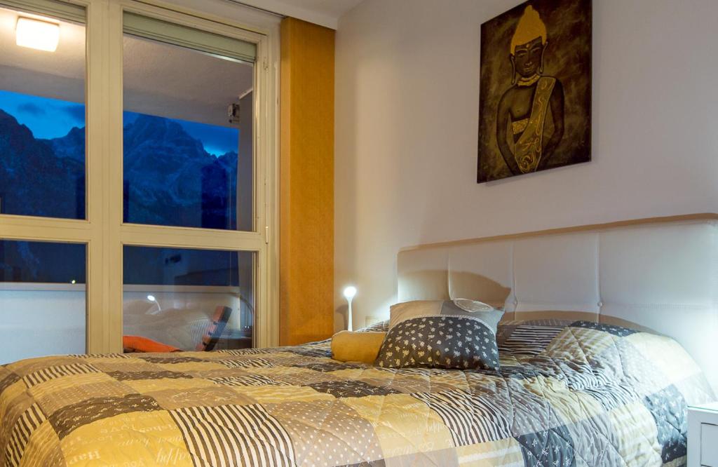 Postel nebo postele na pokoji v ubytování CitySuite Lienz