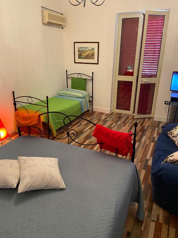 Posteľ alebo postele v izbe v ubytovaní La casa di Gioggiò