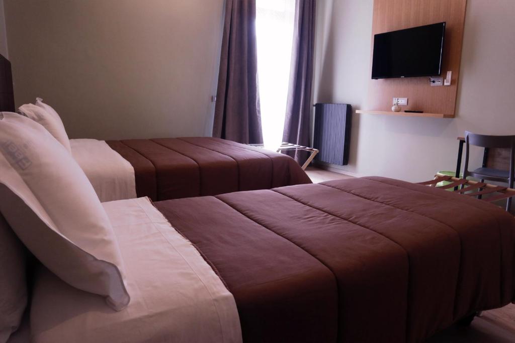Postel nebo postele na pokoji v ubytování Manhattan Room & Suite