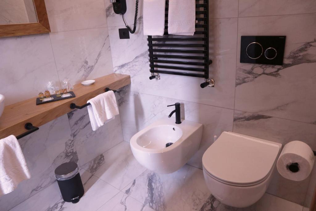 Koupelna v ubytování Manhattan Room & Suite