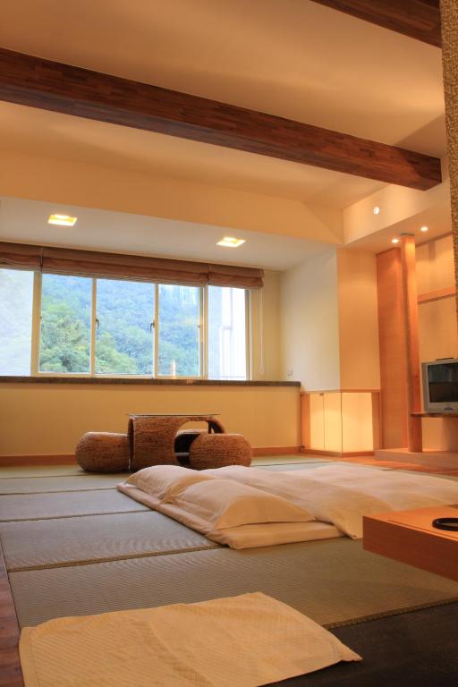 Postel nebo postele na pokoji v ubytování Spring Spa Hotel