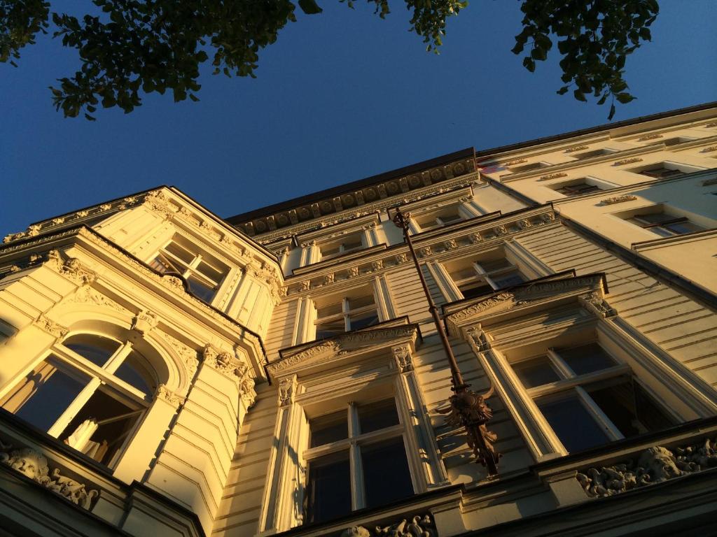 a large building with a clock on the front of it at Grand Hostel Berlin Classic in Berlin
