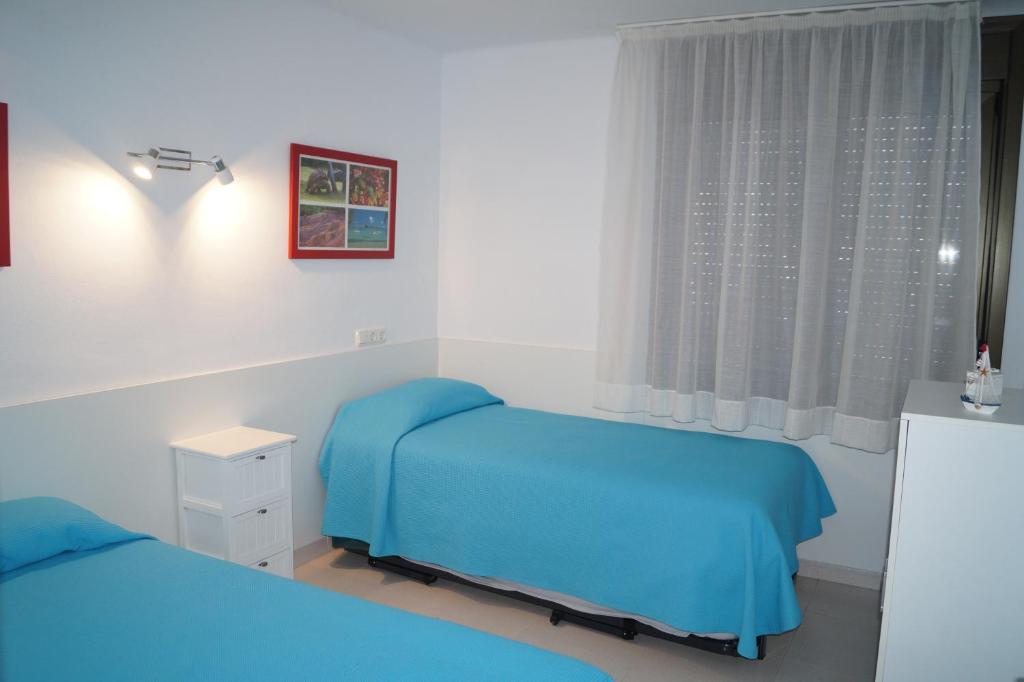 Posteľ alebo postele v izbe v ubytovaní BEACH PARADISE