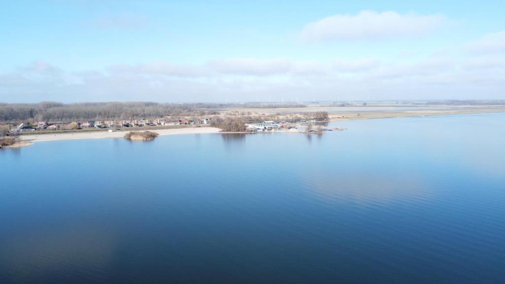 an aerial view of a large body of water at B&B Veluwemeer in Biddinghuizen
