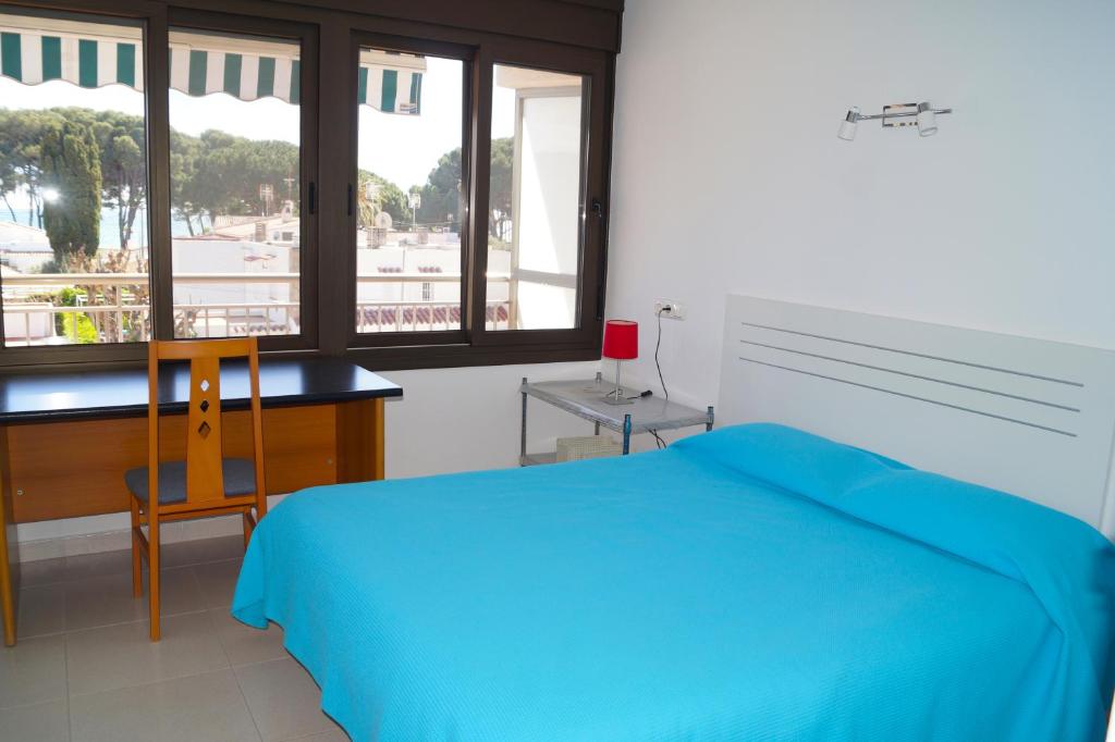 Posteľ alebo postele v izbe v ubytovaní BEACH PARADISE