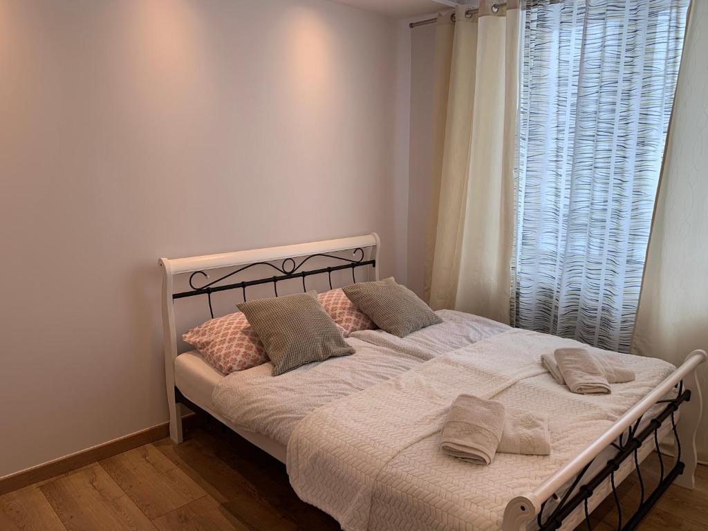 Postel nebo postele na pokoji v ubytování Sweet apartament