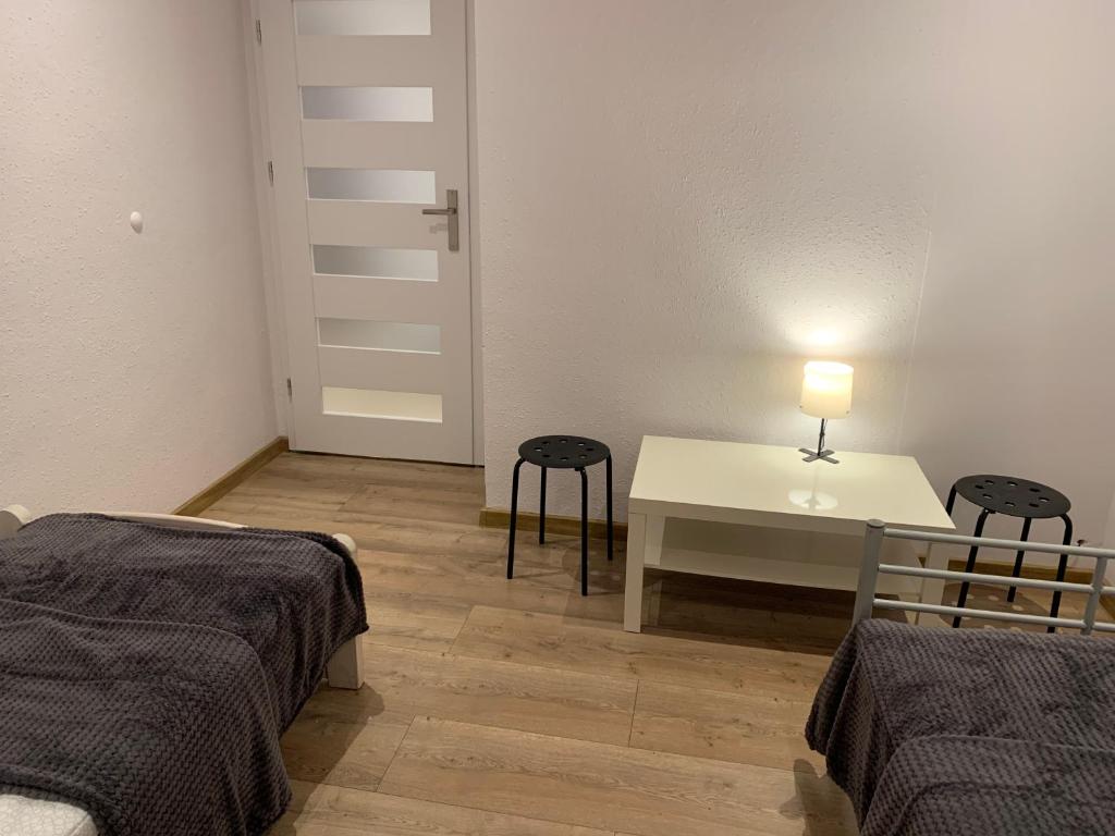 Postel nebo postele na pokoji v ubytování Sweet apartament