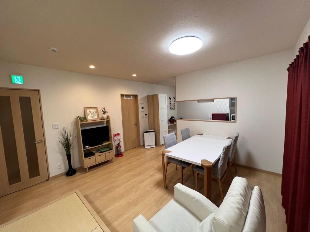 Kuchyň nebo kuchyňský kout v ubytování Guesthouse Kaede Annex