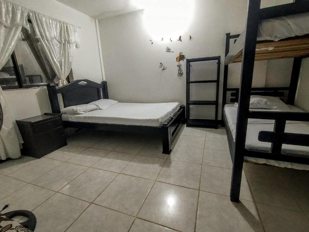 Postel nebo postele na pokoji v ubytování Oasis de Tolú