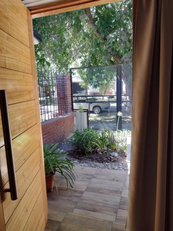 a door leading to a patio with a yard at Petit Jardin in San Rafael