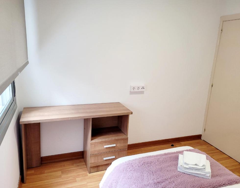 Postel nebo postele na pokoji v ubytování Amplio piso próximo a la Catedral y el Camino. C2