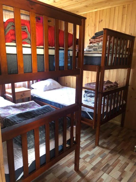 Postel nebo postele na pokoji v ubytování Cabañas Terra Nova Colbun Machicura