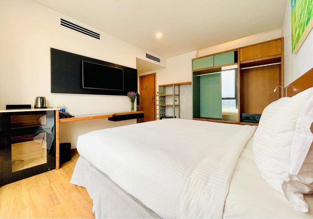 Postel nebo postele na pokoji v ubytování NAM Hotel & Residences