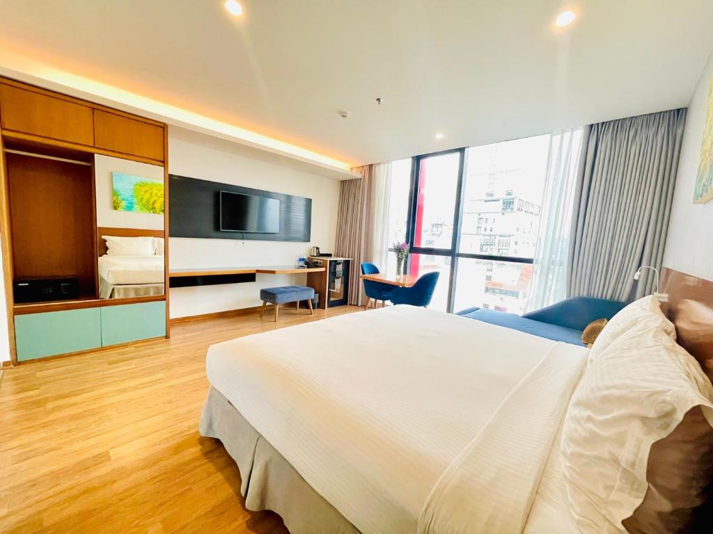 TV a/nebo společenská místnost v ubytování NAM Hotel & Residences
