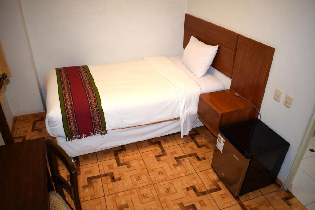 Postel nebo postele na pokoji v ubytování Mantu Boutique