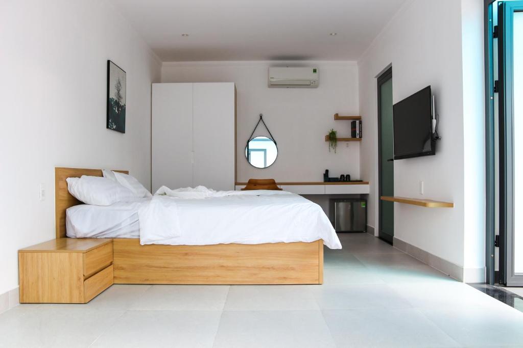 Postel nebo postele na pokoji v ubytování Minh Hai Resort