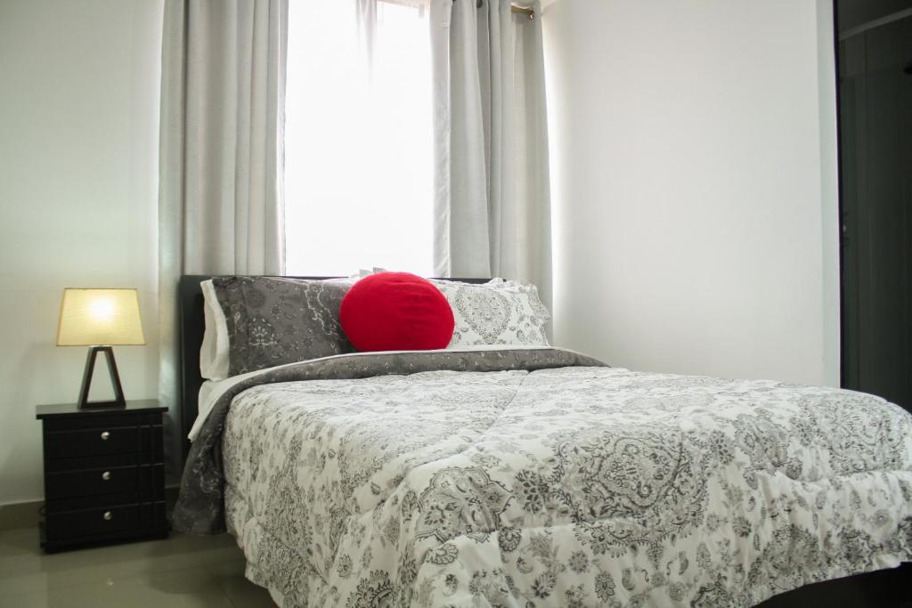Postel nebo postele na pokoji v ubytování Apartahotel Kelly