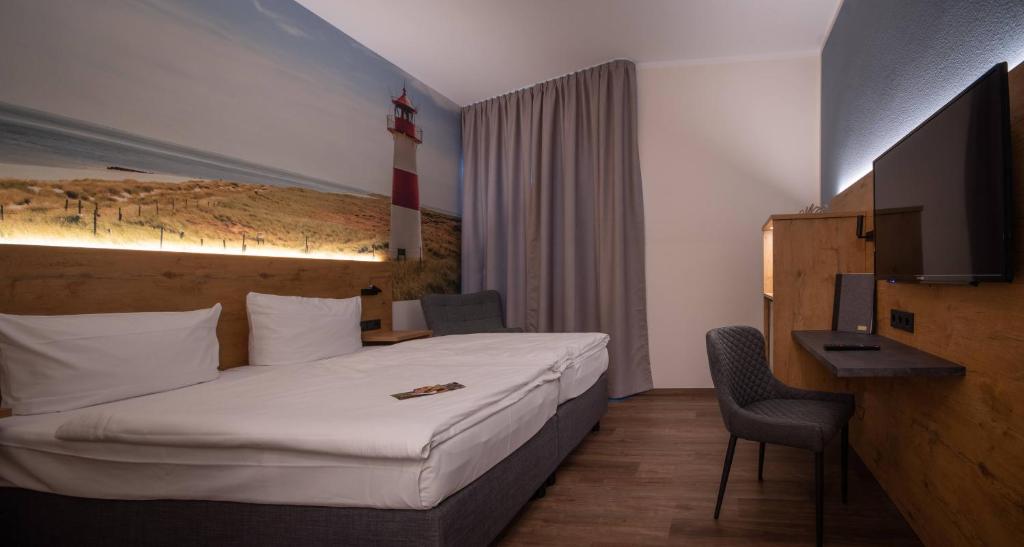 TV a/nebo společenská místnost v ubytování Hotel Stadt Aurich