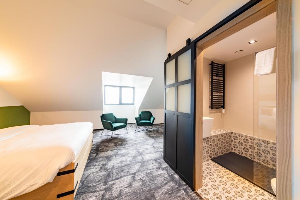 Postel nebo postele na pokoji v ubytování De BrauHotel