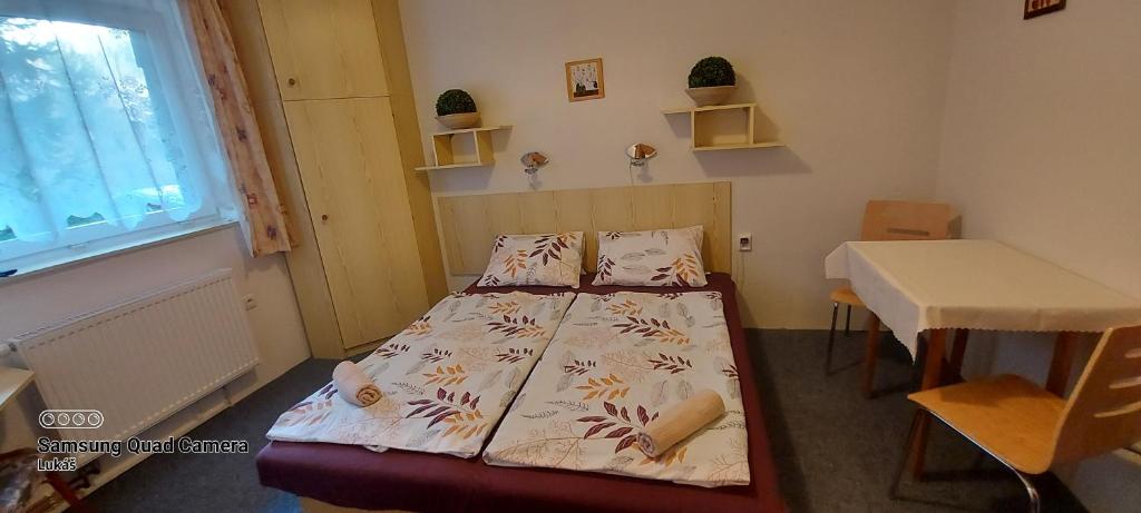 Postel nebo postele na pokoji v ubytování Penzion Svojanov