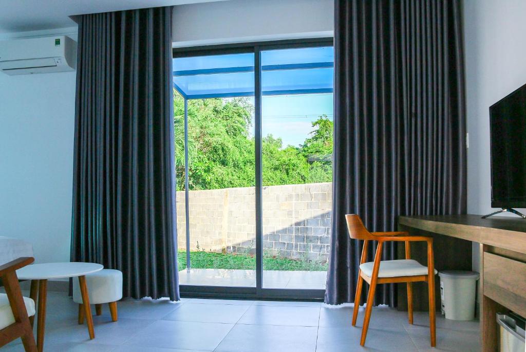 TV a/nebo společenská místnost v ubytování Minh Hai Resort