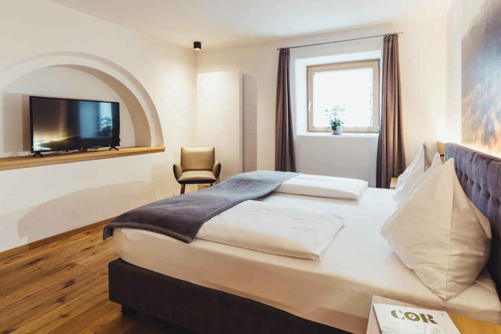 Postel nebo postele na pokoji v ubytování Hotel Schmuckhof