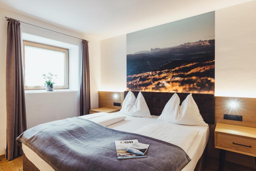 Postel nebo postele na pokoji v ubytování Hotel Schmuckhof
