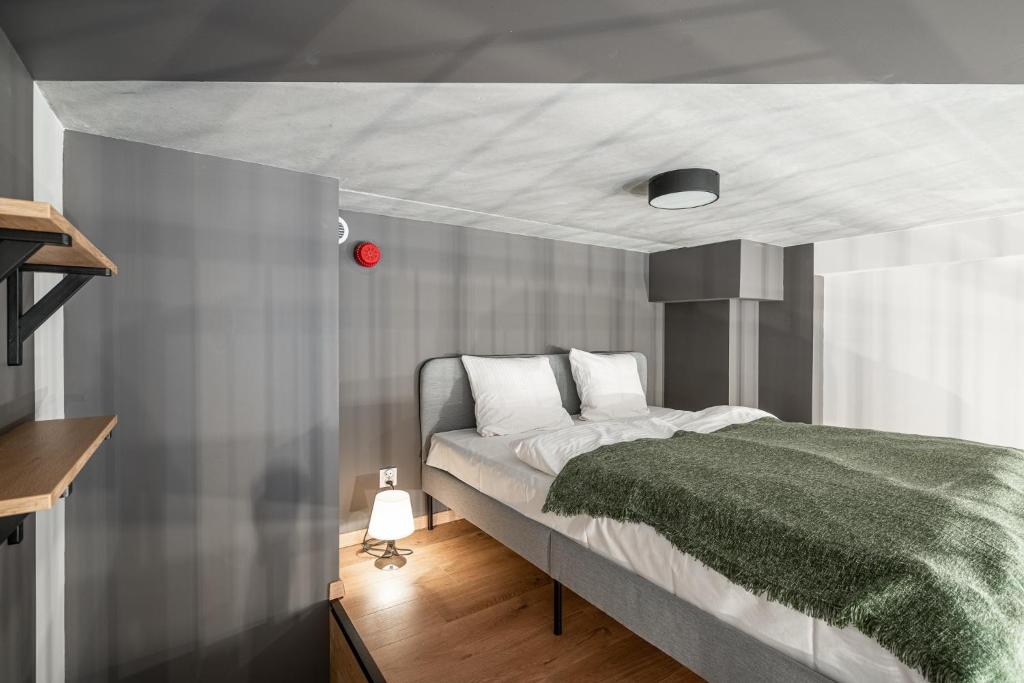 Posteľ alebo postele v izbe v ubytovaní RentPlanet - Apartamenty Zarembowicza