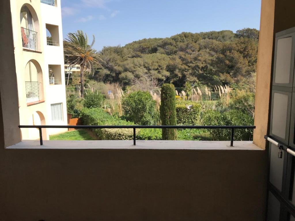 a view of a garden from a balcony at Boost Your Immo Rivages Six-Fours-les-Plages 706 in Six-Fours-les-Plages