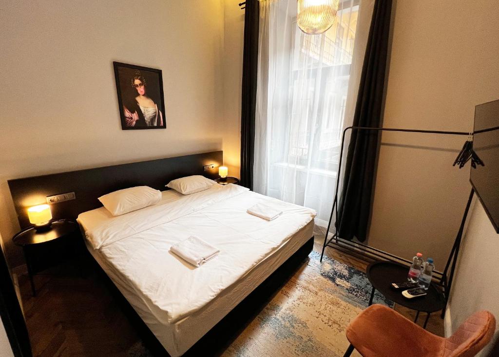 Postel nebo postele na pokoji v ubytování Hotel Rumor