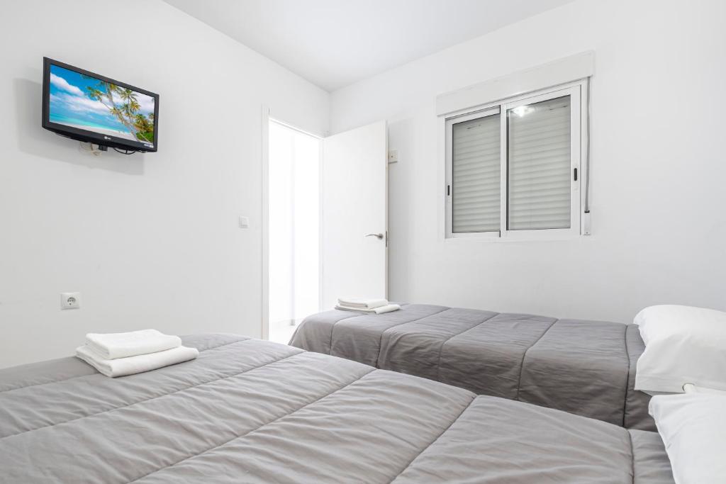 Posteľ alebo postele v izbe v ubytovaní Bacana 3-3 Apartment Levante Beach