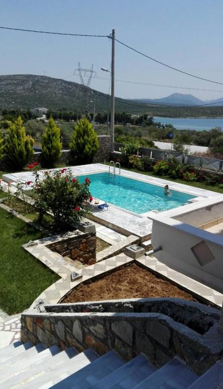 The swimming pool at or close to Dimitris Vaso’s Villa with Sea and Mountain View!
