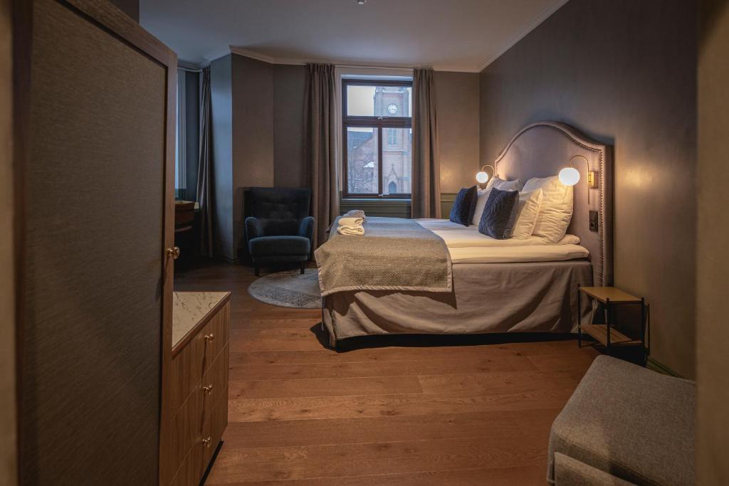 Postel nebo postele na pokoji v ubytování Hotel Fredrikstad