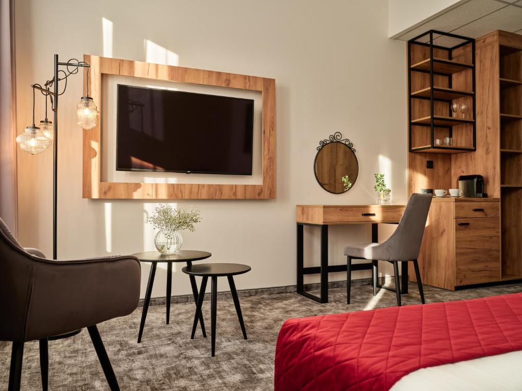 TV a/nebo společenská místnost v ubytování 1891 Garni Hotel