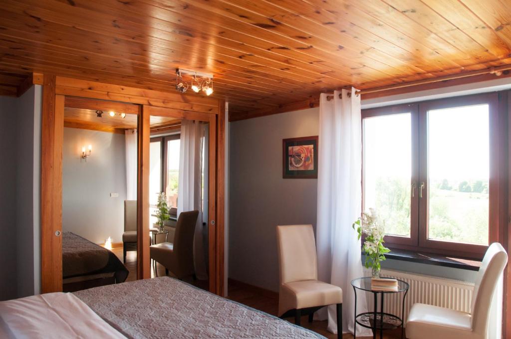 Postel nebo postele na pokoji v ubytování Mazurski Zakątek-Apartamenty