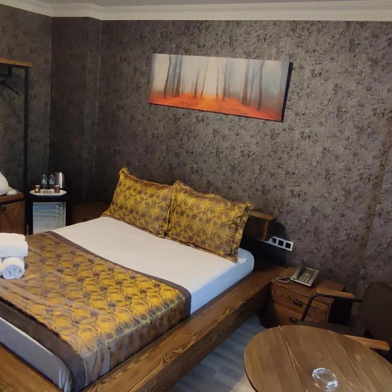 Postel nebo postele na pokoji v ubytování Zengin City Hotel