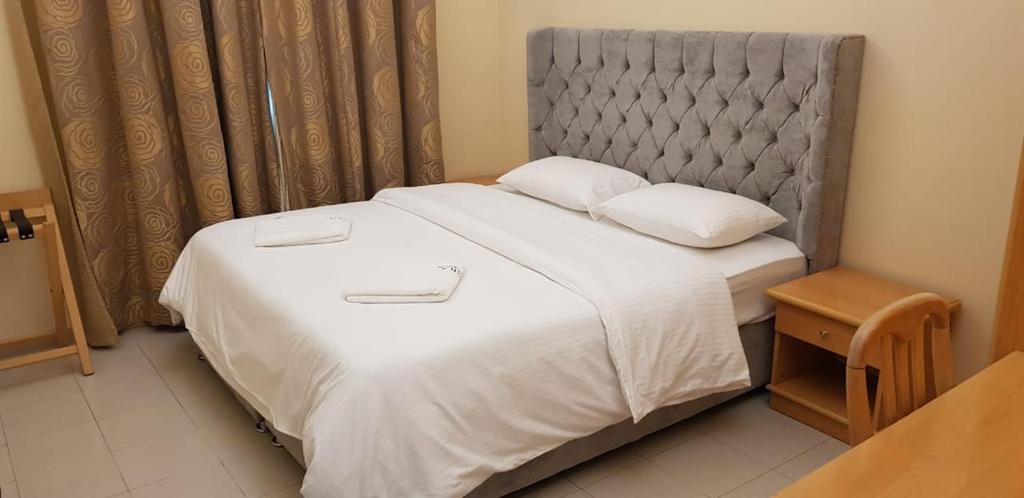 Postel nebo postele na pokoji v ubytování Esra Hotel Apartment