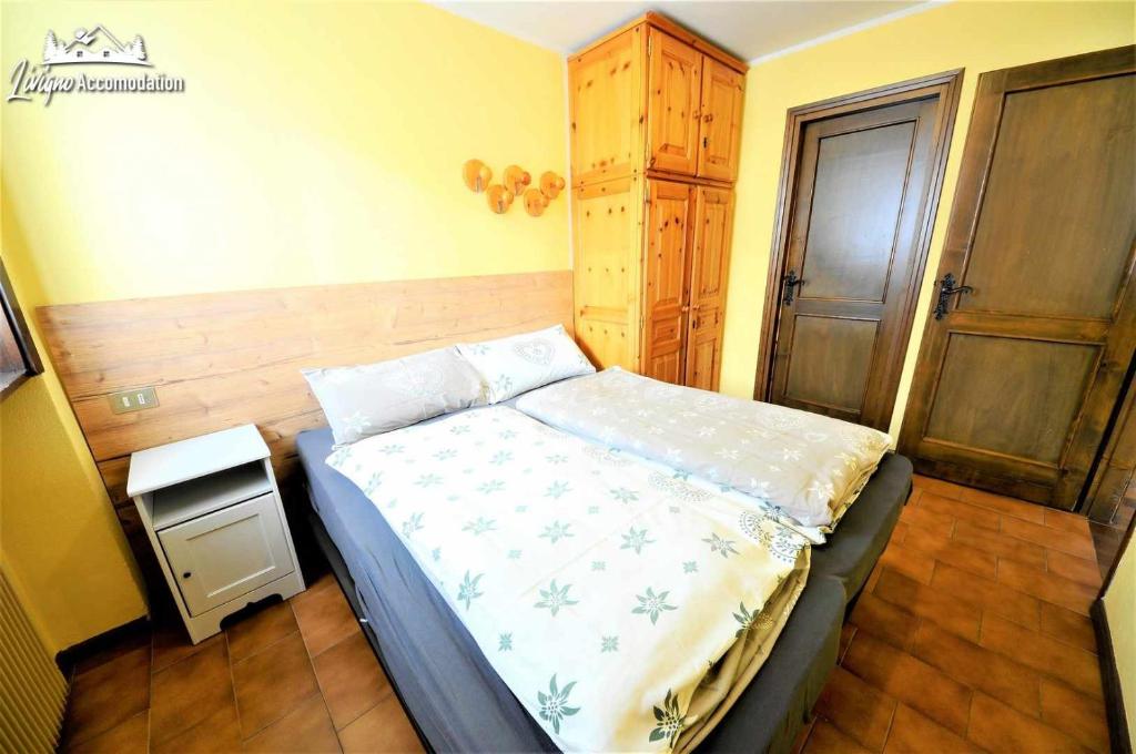 Posteľ alebo postele v izbe v ubytovaní Baite Costaccia App 3 by Livigno Accomodation