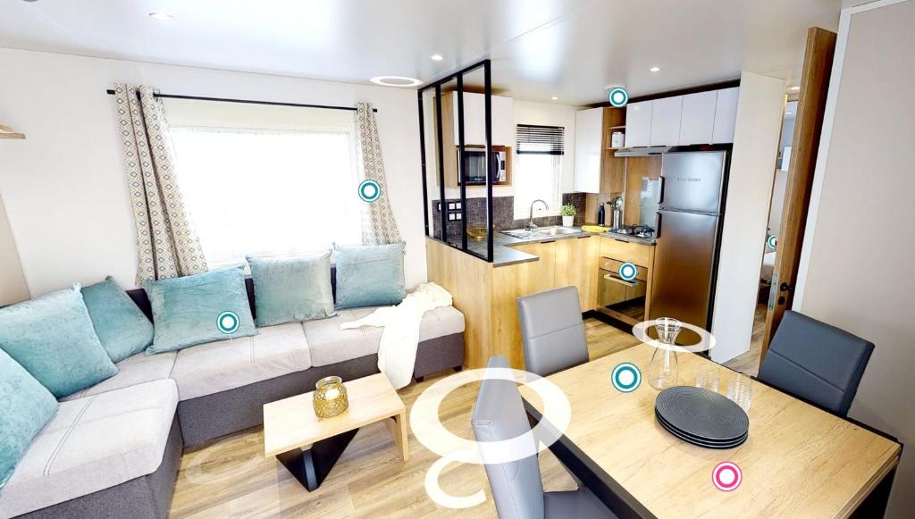 Posezení v ubytování Bungalow confortable à Saint-Jean-de-Monts avec piscine partagée