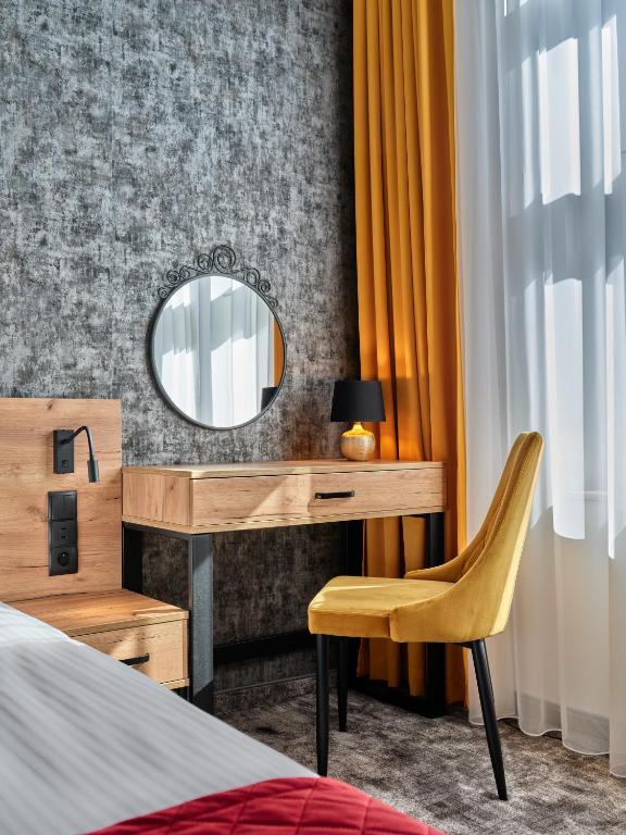 Postel nebo postele na pokoji v ubytování 1891 Garni Hotel
