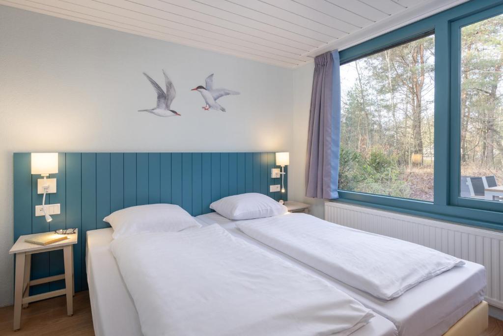 Postel nebo postele na pokoji v ubytování Center Parcs Vossemeren