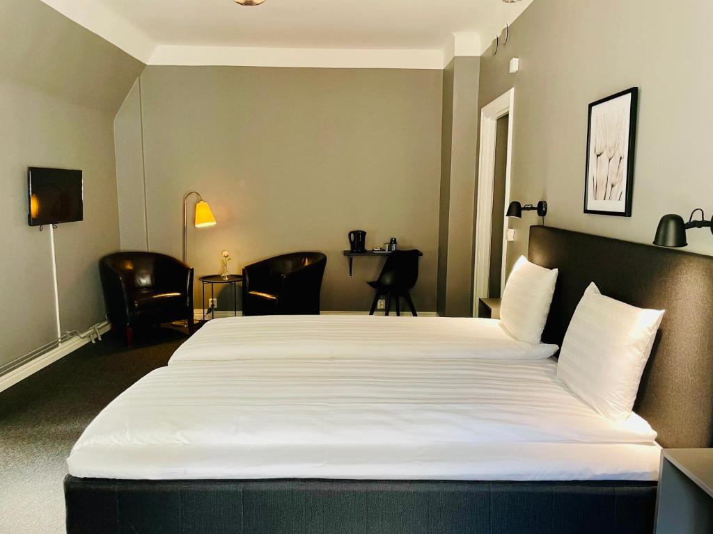 Postel nebo postele na pokoji v ubytování Birka Hotel