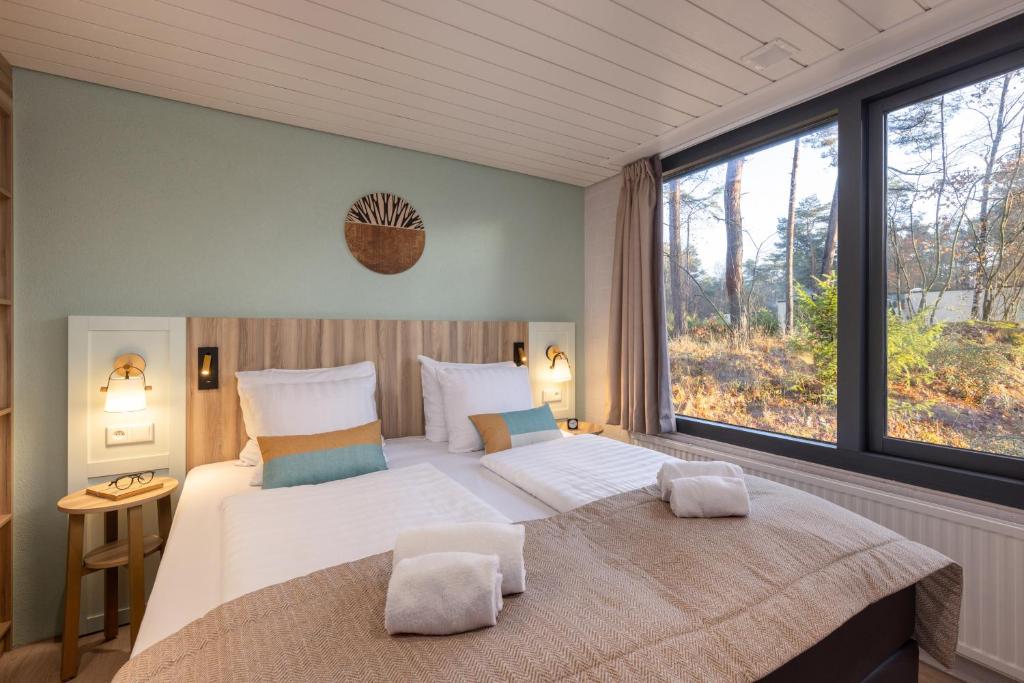Postel nebo postele na pokoji v ubytování Center Parcs Vossemeren