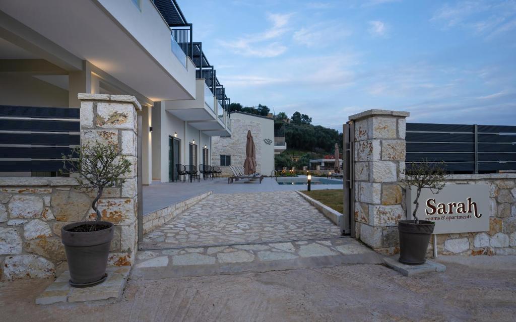 a building with a sign that reads santilli at Sarah Luxury Rooms in Syvota