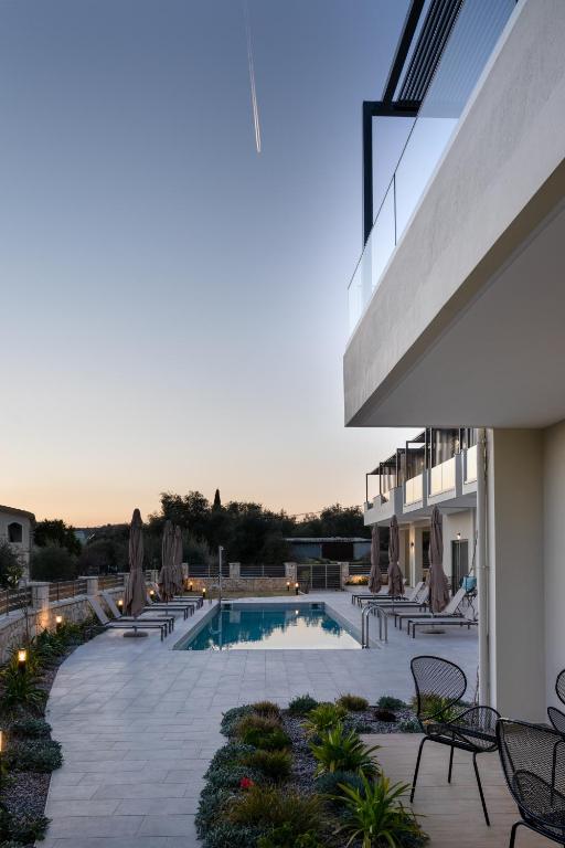 a view of a swimming pool on a building at Sarah Luxury Rooms in Syvota