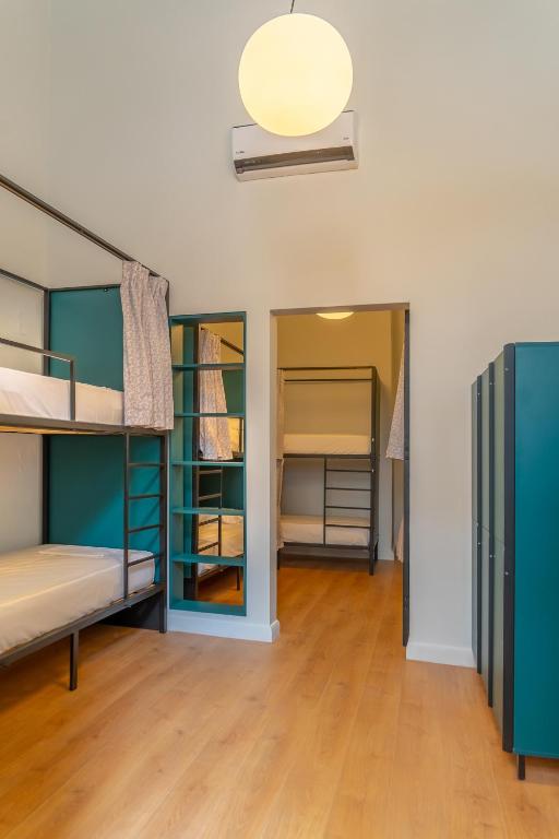 Postel nebo postele na pokoji v ubytování Intra Muros Hostel