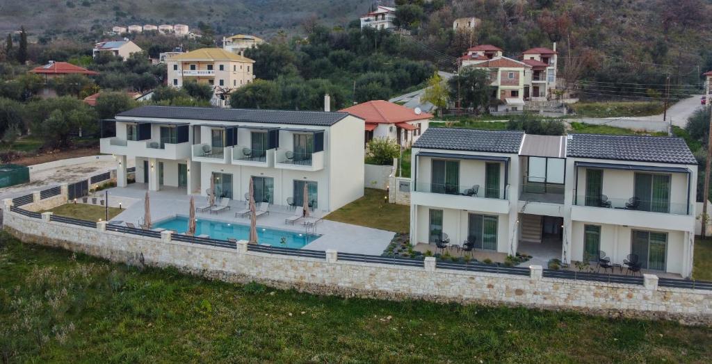 an aerial view of a house with a swimming pool at Sarah Luxury Rooms in Syvota