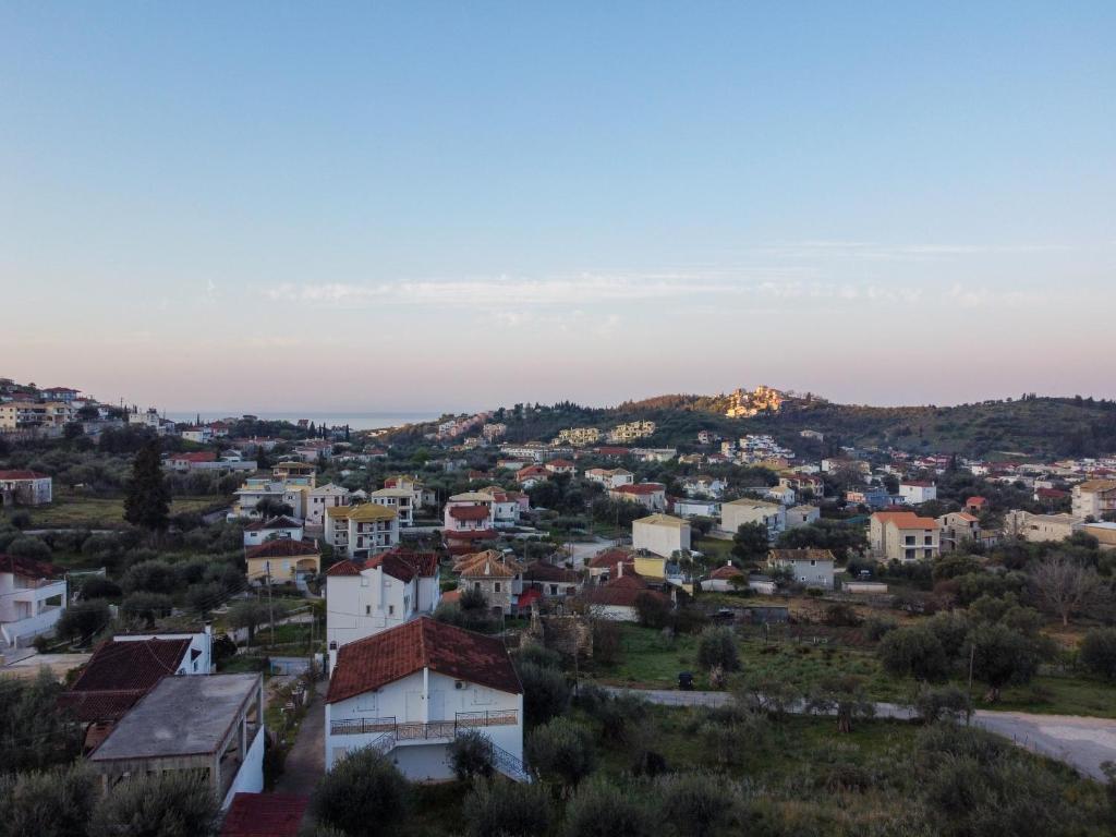 an aerial view of a small town at sunset at Sarah Luxury Rooms in Syvota